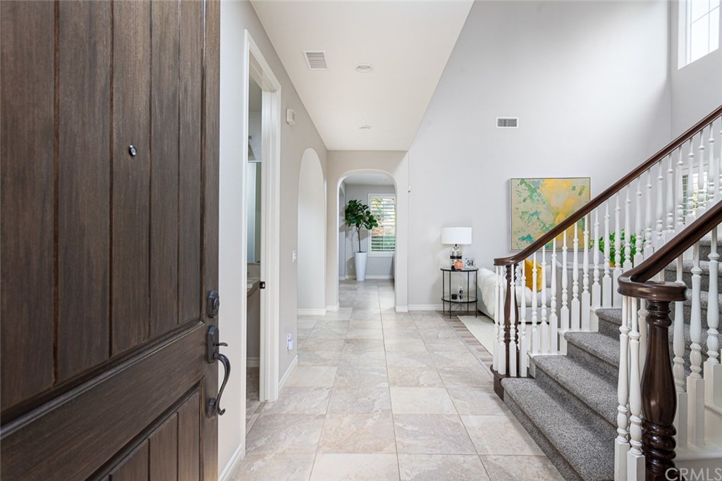 3932 Killymoon Circle Yorba Linda, CA 92886 - Photo 2 of 25 a view of a hallway with wooden floor and stairs