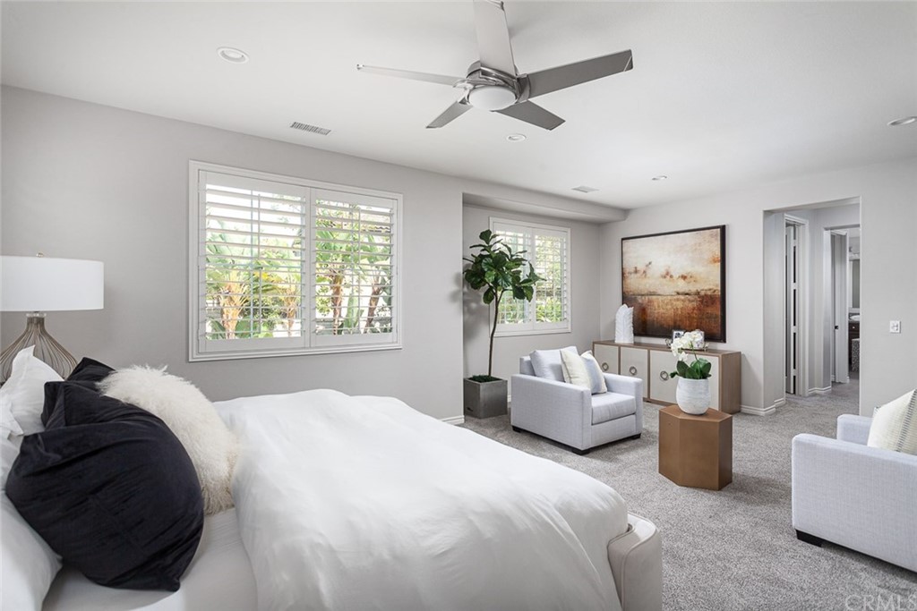 3932 Killymoon Circle Yorba Linda, CA 92886 - Photo 21 of 25 a bedroom with a bed a couch and potted plant