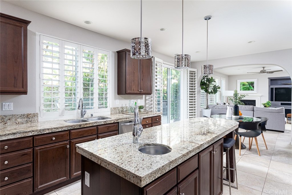 3932 Killymoon Circle Yorba Linda, CA 92886 - Photo 8 of 25 a kitchen with granite countertop counter space windows and a sink
