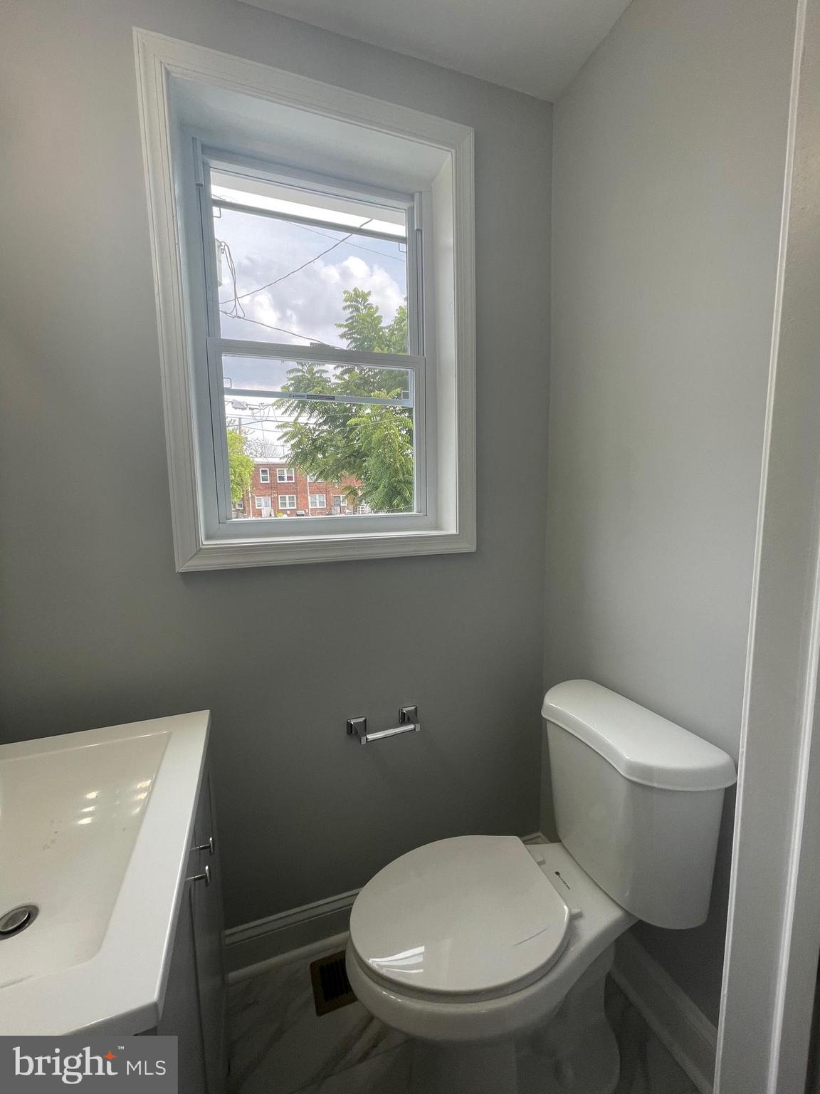 3619 Manchester Avenue Baltimore, MD 21215 - Photo 12 of 33 a white toilet sitting next to a window