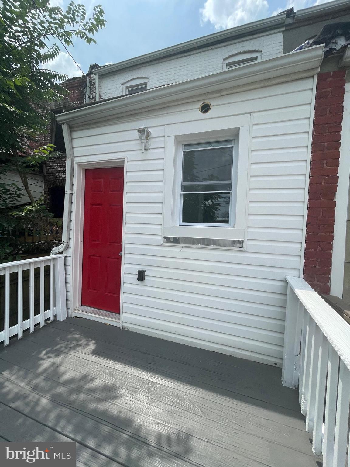 3619 Manchester Avenue Baltimore, MD 21215 - Photo 16 of 33 a view of a red door of the house