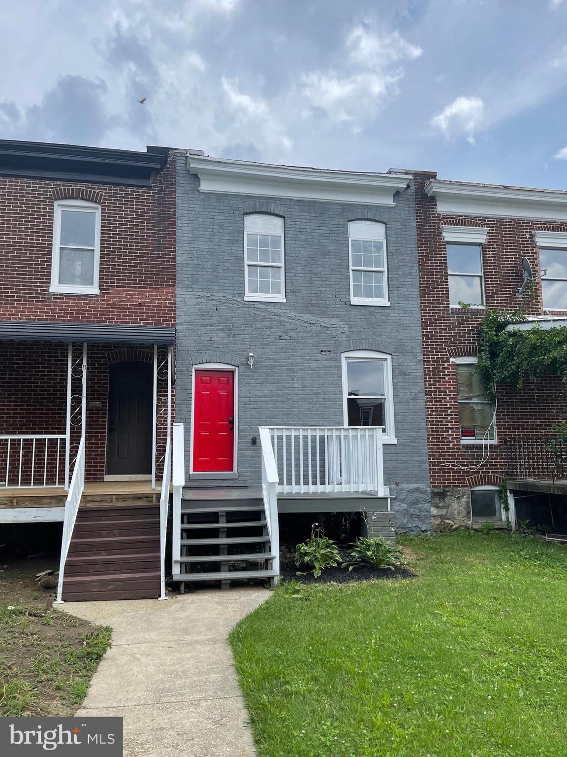 3619 Manchester Avenue Baltimore, MD 21215 - Photo 2 of 33 a front view of a house with garden
