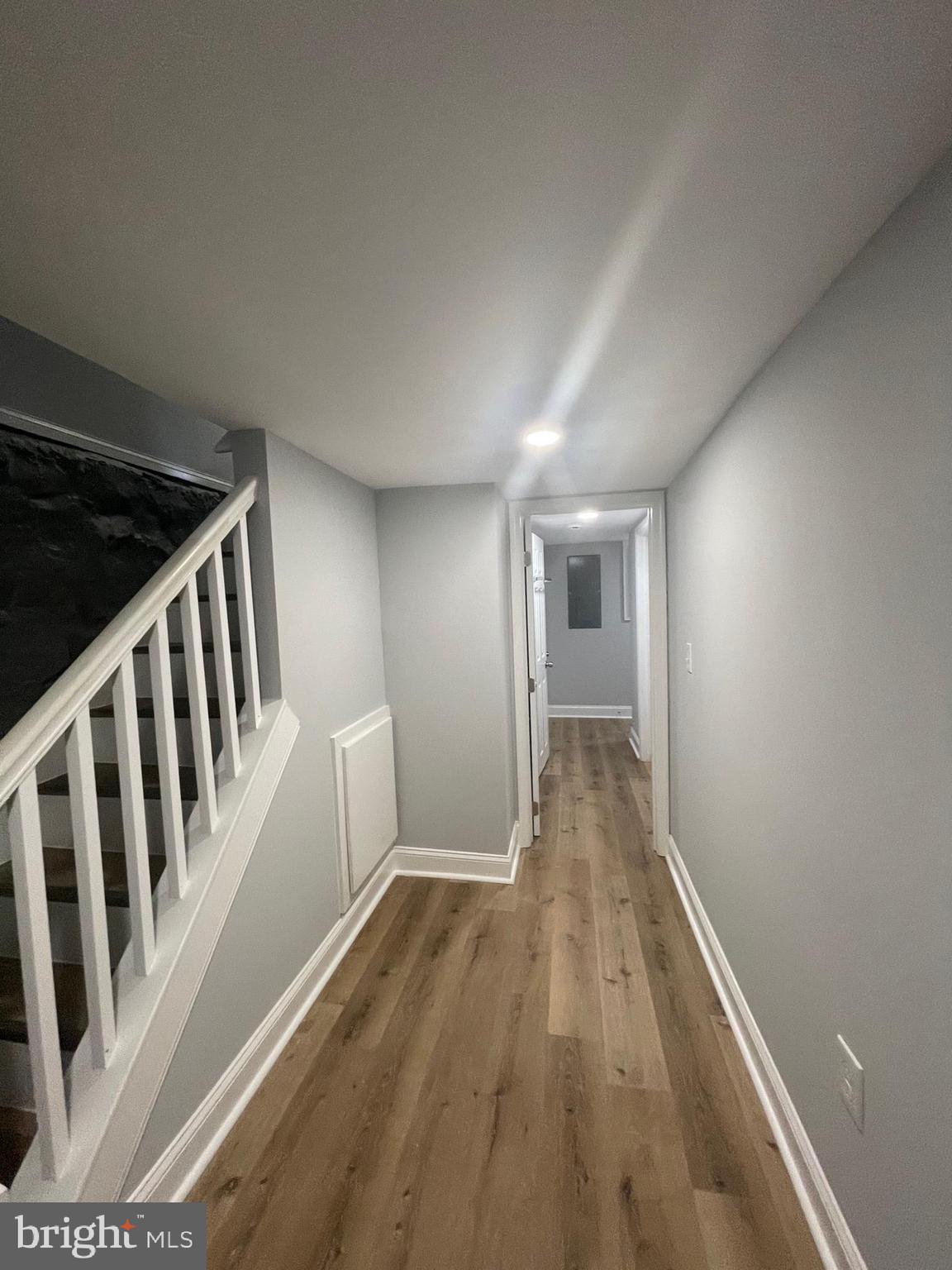 3619 Manchester Avenue Baltimore, MD 21215 - Photo 21 of 33 a view of a hallway with wooden floor and staircase