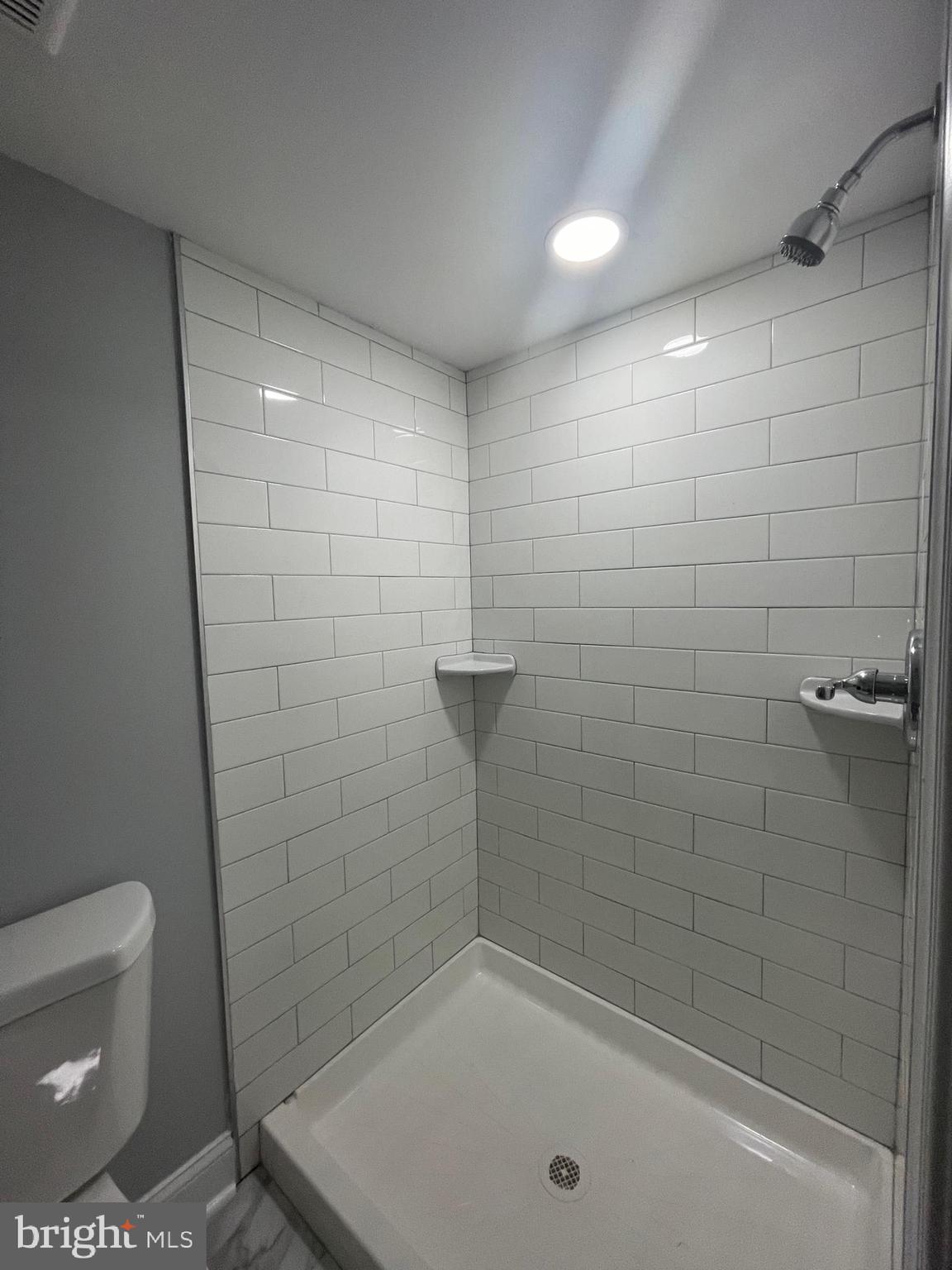 3619 Manchester Avenue Baltimore, MD 21215 - Photo 23 of 33 a bathroom with a shower and toilet