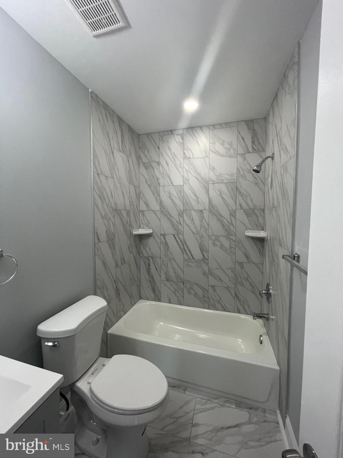 3619 Manchester Avenue Baltimore, MD 21215 - Photo 24 of 33 a bathroom with a toilet and a bathtub