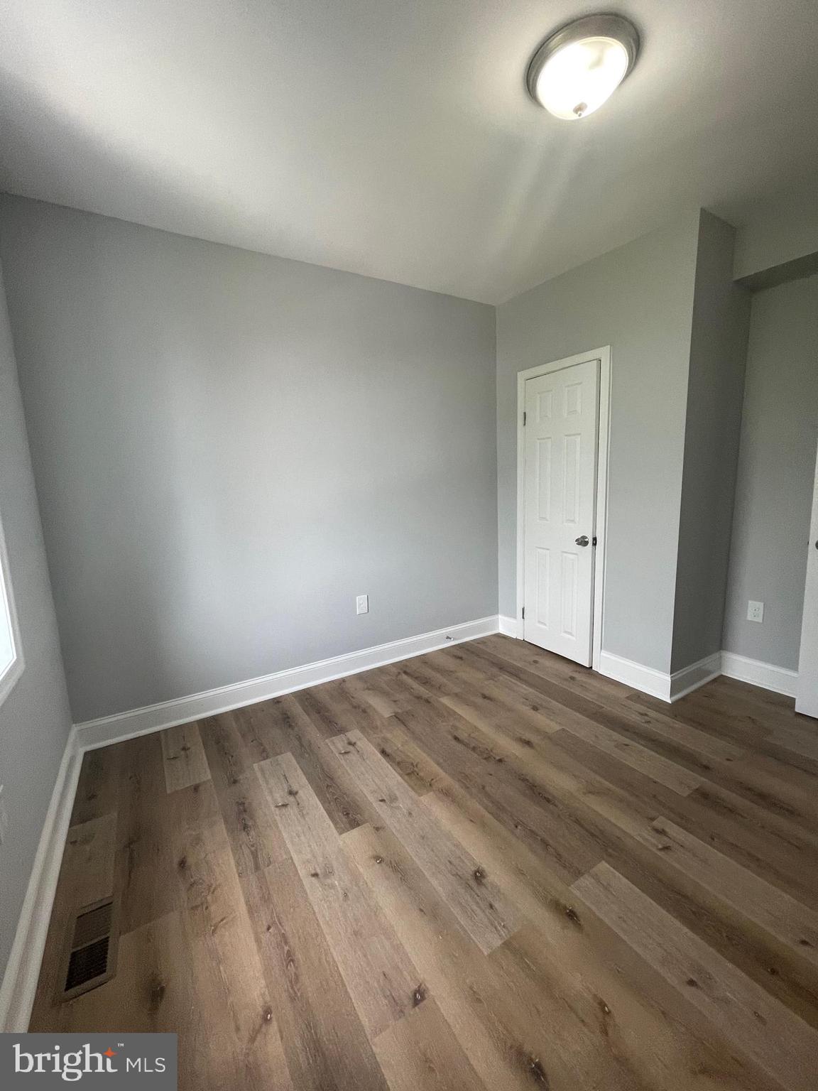 3619 Manchester Avenue Baltimore, MD 21215 - Photo 29 of 33 a view of an empty room and wooden floor