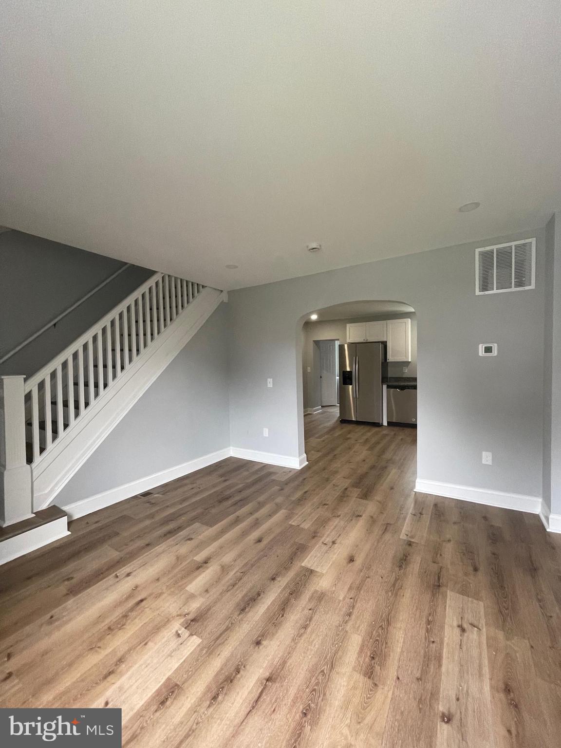 3619 Manchester Avenue Baltimore, MD 21215 - Photo 3 of 33 a view of an empty room and wooden floor