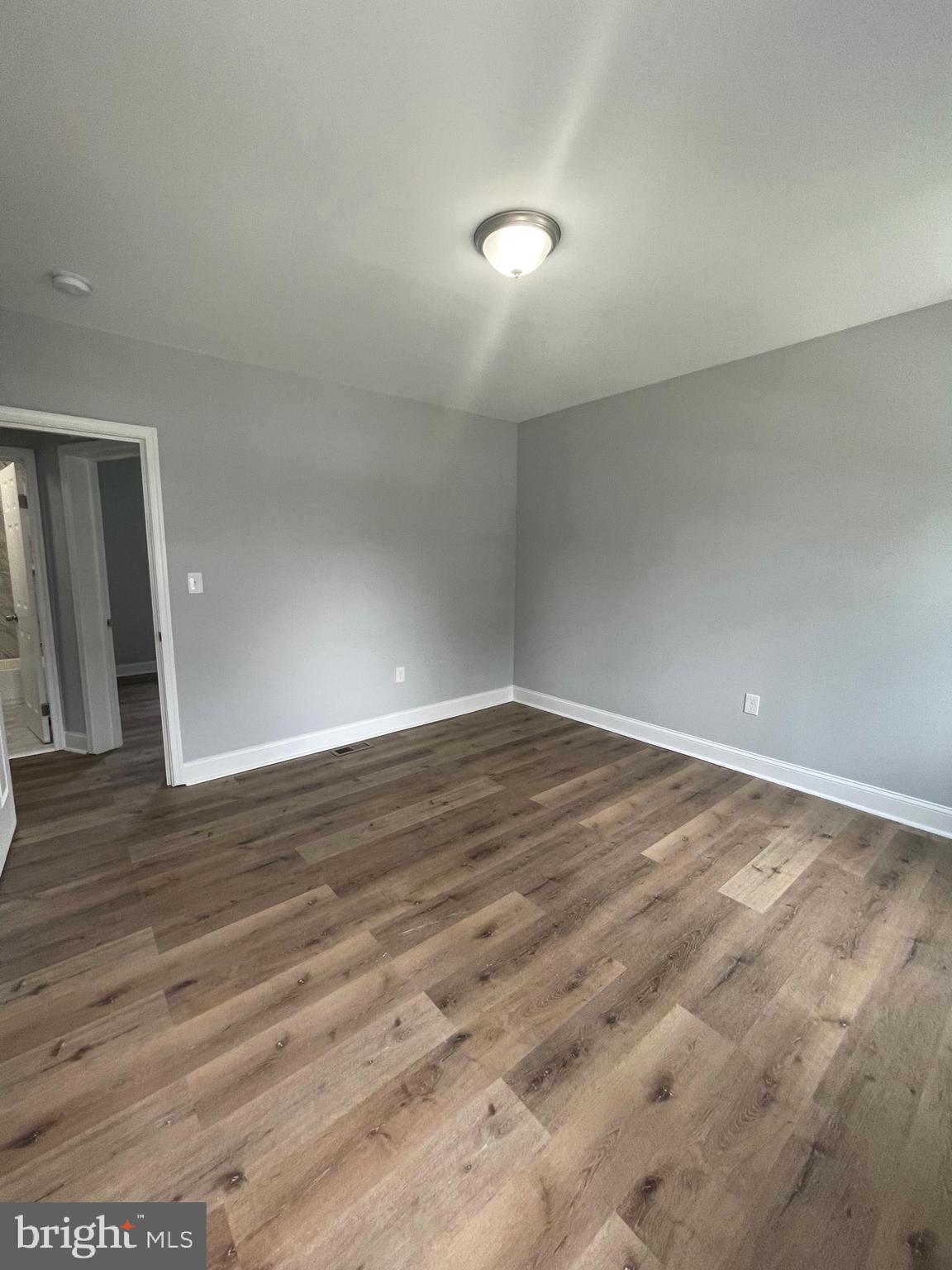 3619 Manchester Avenue Baltimore, MD 21215 - Photo 31 of 33 wooden floor in empty room