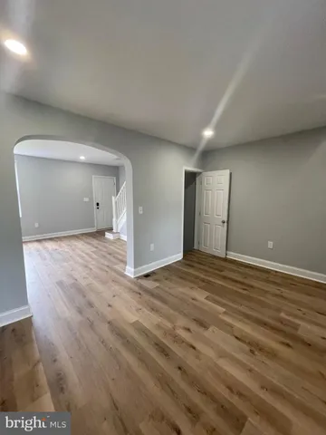 a large kitchen with stainless steel appliances granite countertop a stove and a refrigerator