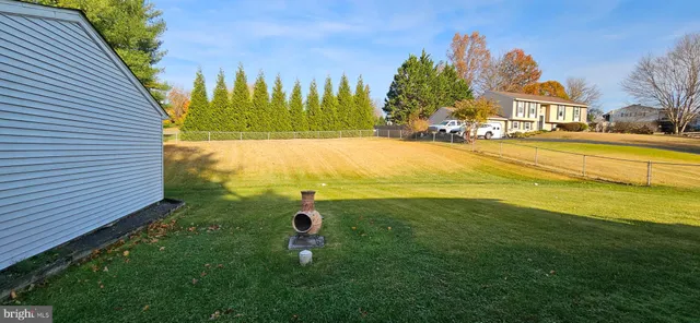 a view of a swimming pool with an outdoor space and seating area