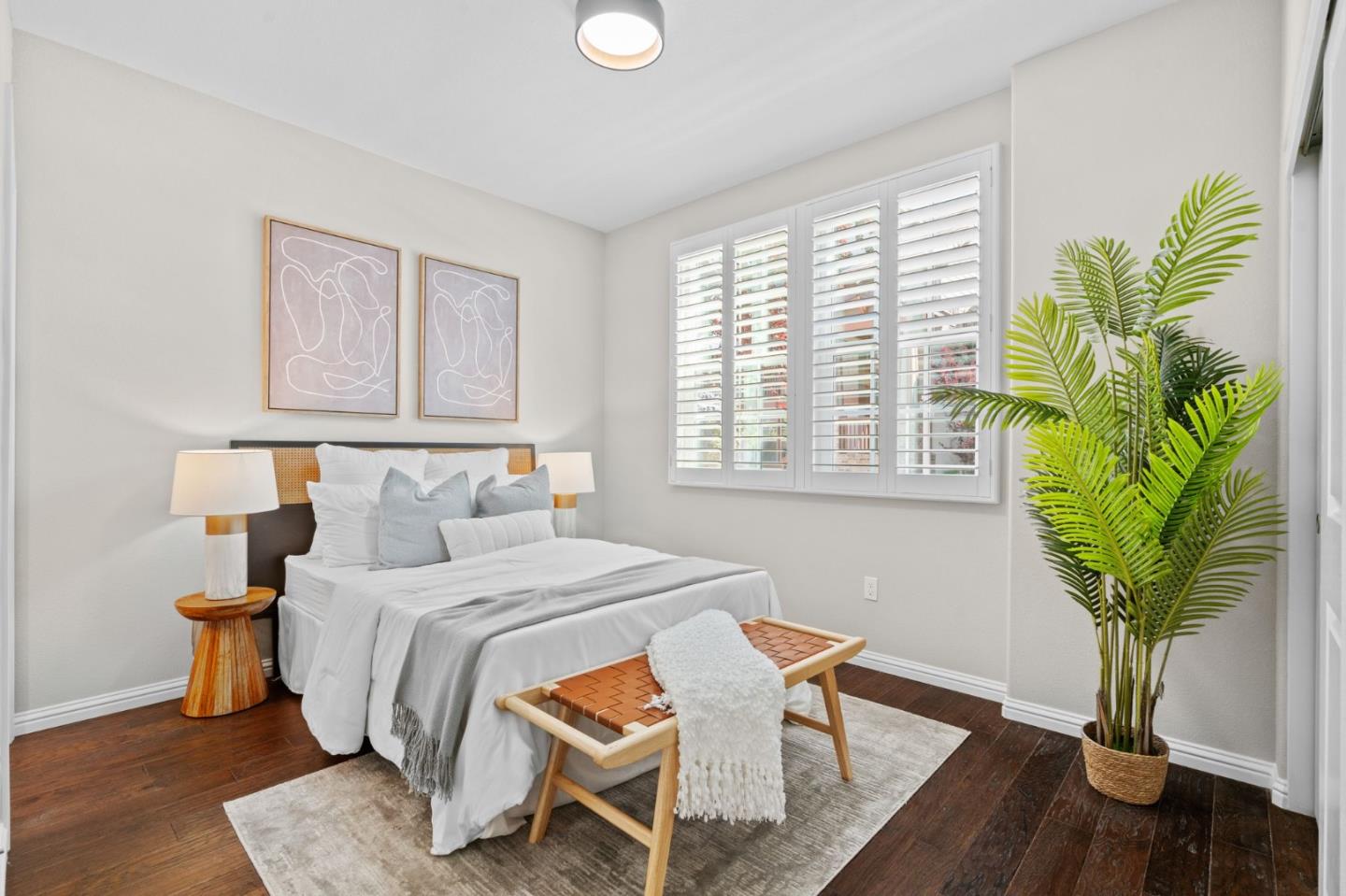 3406 Pyramid Way Mountain View, CA 94043 - Photo 24 of 41 a bedroom with a bed table and a potted plant