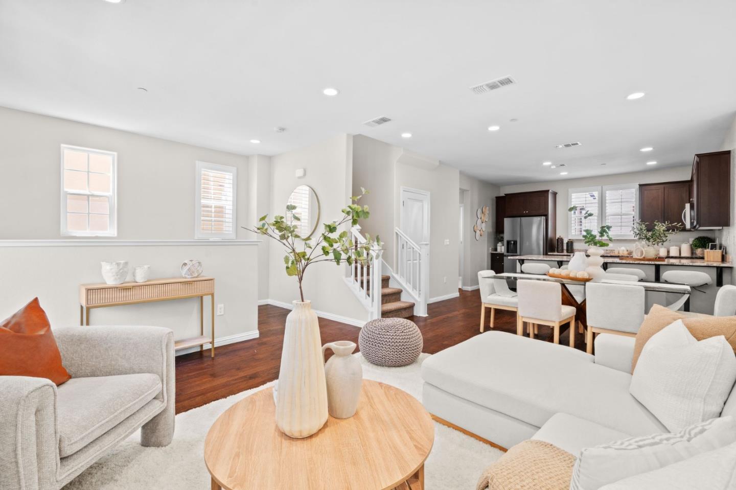 3406 Pyramid Way Mountain View, CA 94043 - Photo 3 of 41 a living room with furniture a kitchen view and a dining table