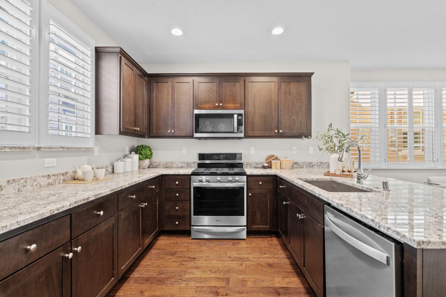 3406 Pyramid Way Mountain View, CA 94043 - Photo 9 of 41 a kitchen with stainless steel appliances granite countertop a sink stove and cabinets