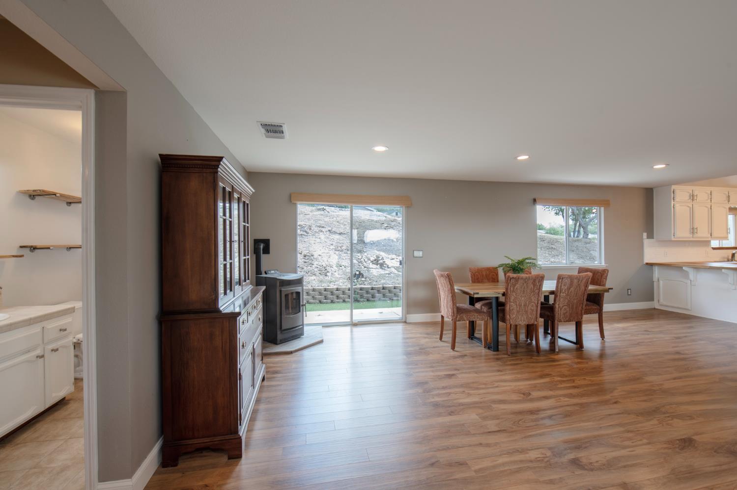 29395 Revis Road Coarsegold, CA 93614 - Photo 13 of 32 a view of a dining room with furniture window and wooden floor
