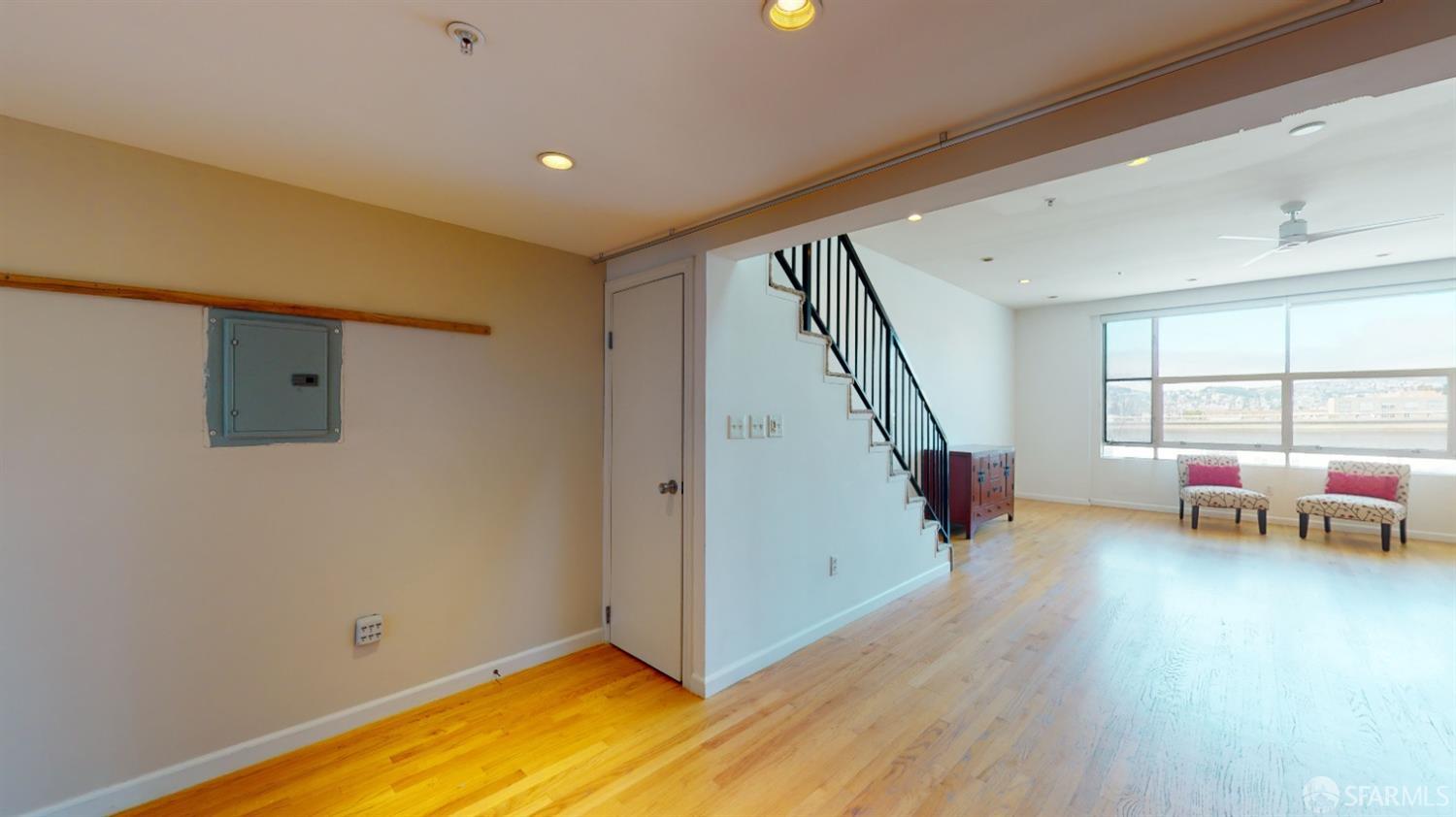 1578 Indiana Street, Unit 11 San Francisco, CA 94107 - Photo 17 of 23 a view of an empty room with window and wooden floor