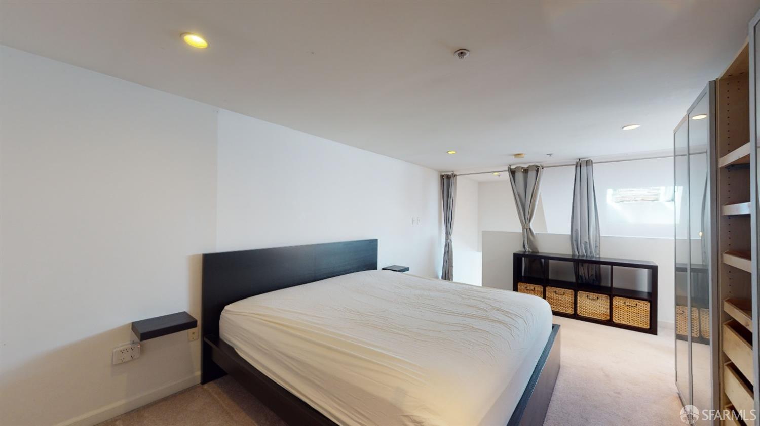 1578 Indiana Street, Unit 11 San Francisco, CA 94107 - Photo 20 of 23 a bedroom with a bed and a lamp with window