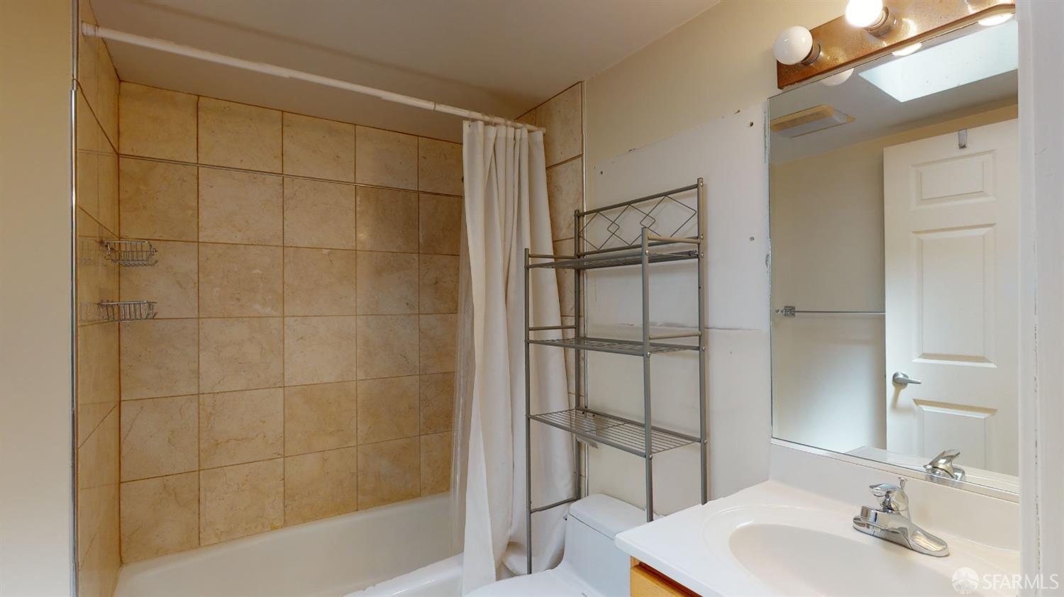 1578 Indiana Street, Unit 11 San Francisco, CA 94107 - Photo 22 of 23 a bathroom with a shower and a sink