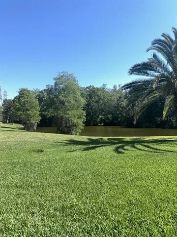 a view of a golf course with a lake