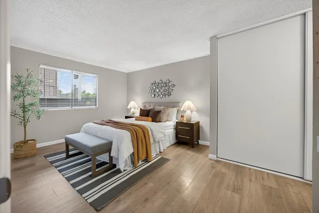 a bedroom with bed and a window