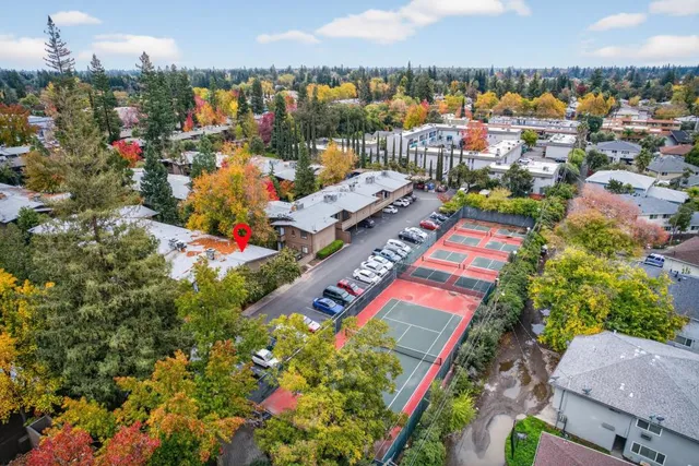 a view of a small house with roof deck