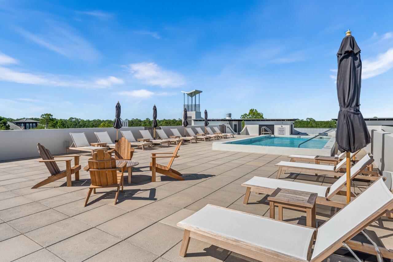 136 Georgetown Avenue, Unit 1A4 Inlet Beach, FL 32461 - Photo 18 of 27 a view of a terrace with furniture and city view