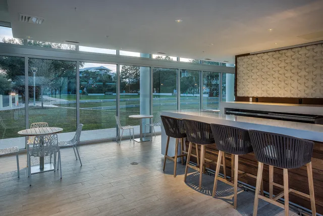 a dining room with furniture and wooden floor