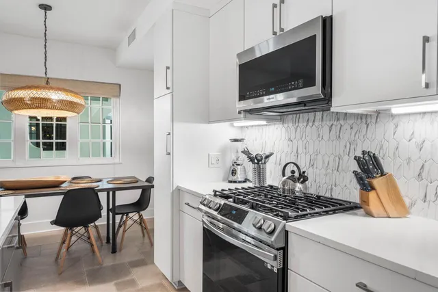 a kitchen with a stove and a microwave