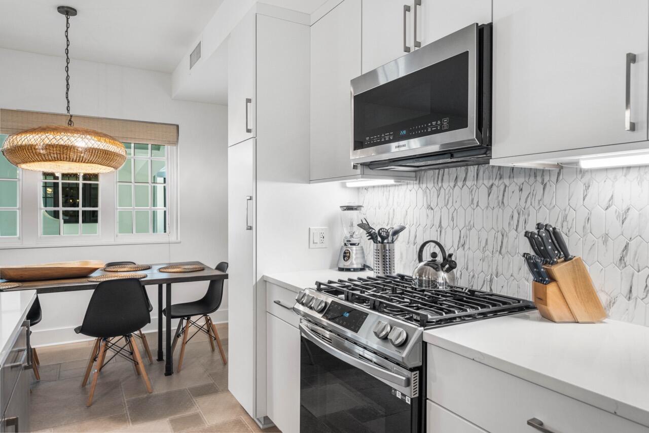 136 Georgetown Avenue, Unit 1A4 Inlet Beach, FL 32461 - Photo 7 of 27 a kitchen with a stove and a microwave