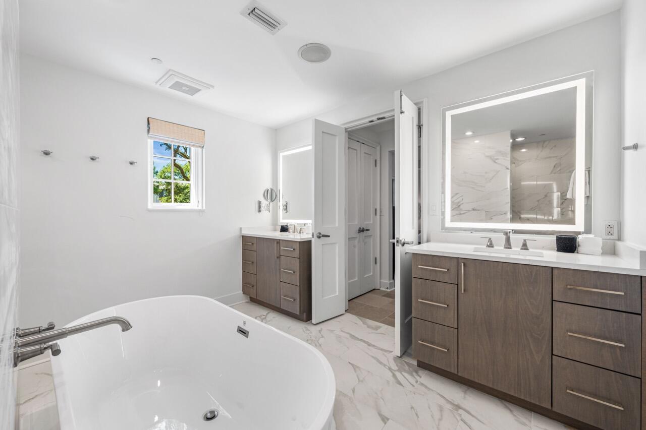 136 Georgetown Avenue, Unit 1A4 Inlet Beach, FL 32461 - Photo 10 of 27 a bathroom with a tub sink and mirror