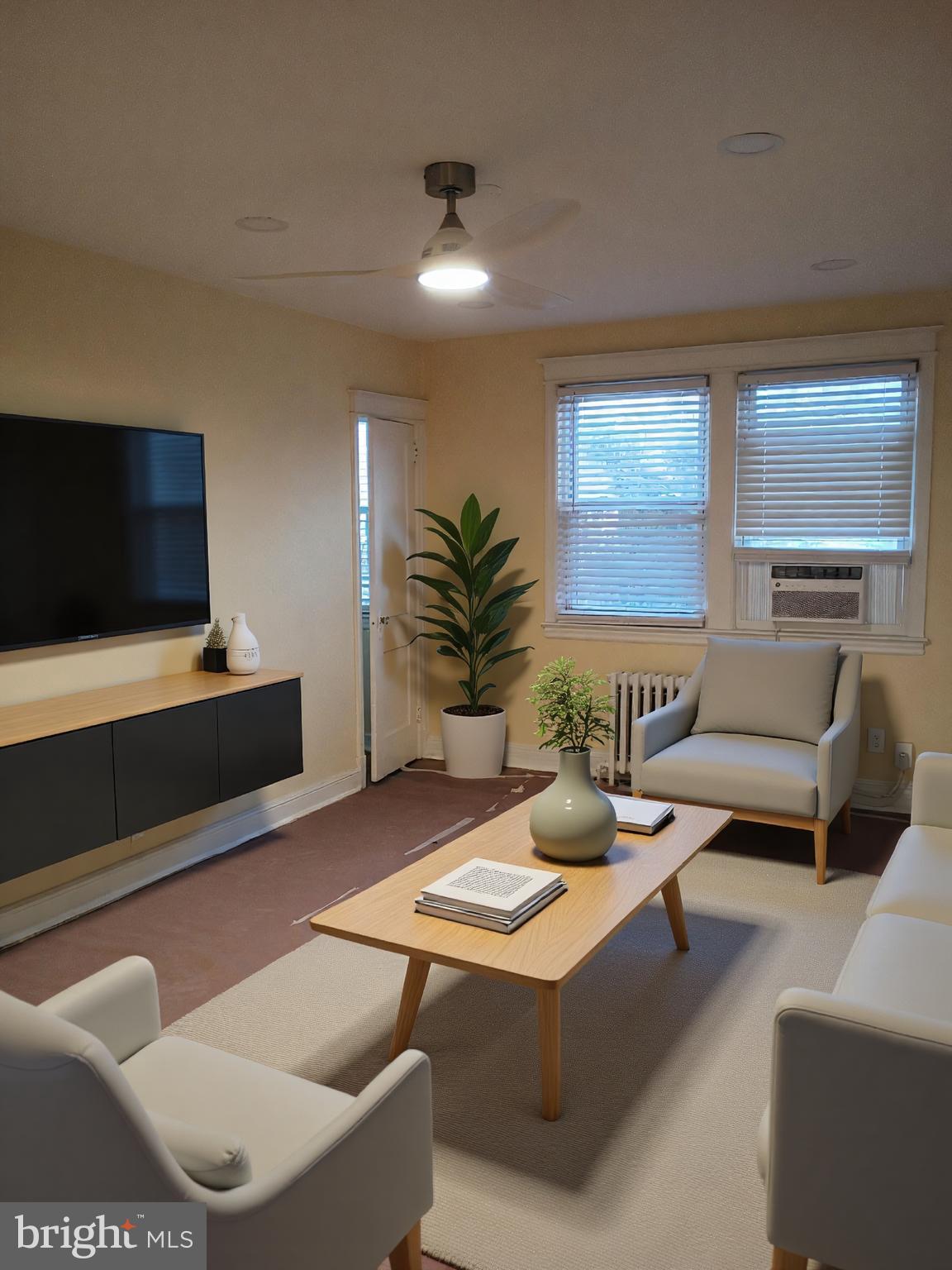a living room with furniture and a flat screen tv