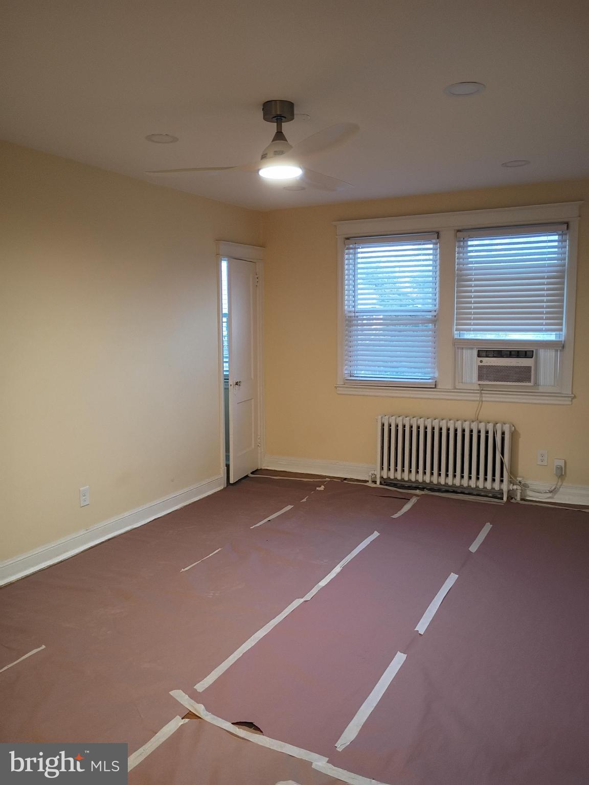 5220 4th Street Northwest, Unit 3 Washington, DC 20011 - Photo 5 of 10 an empty room with stairs and windows