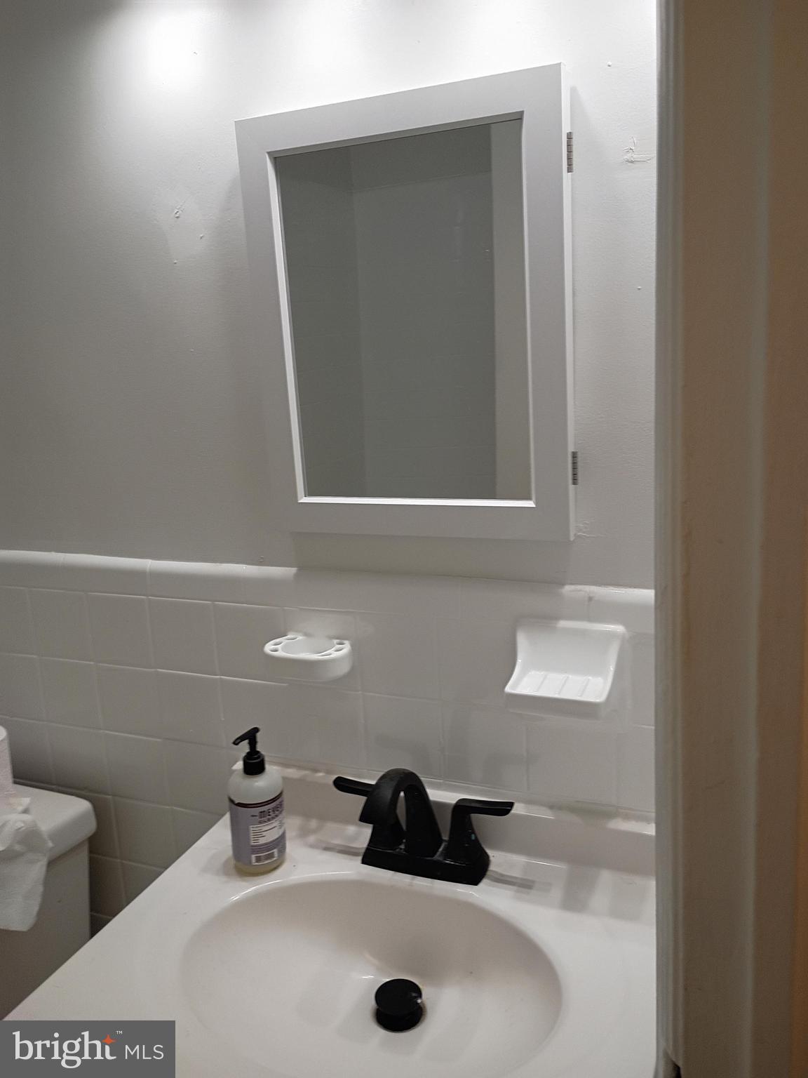 5220 4th Street Northwest, Unit 3 Washington, DC 20011 - Photo 8 of 10 a bathroom with a sink and a toilet