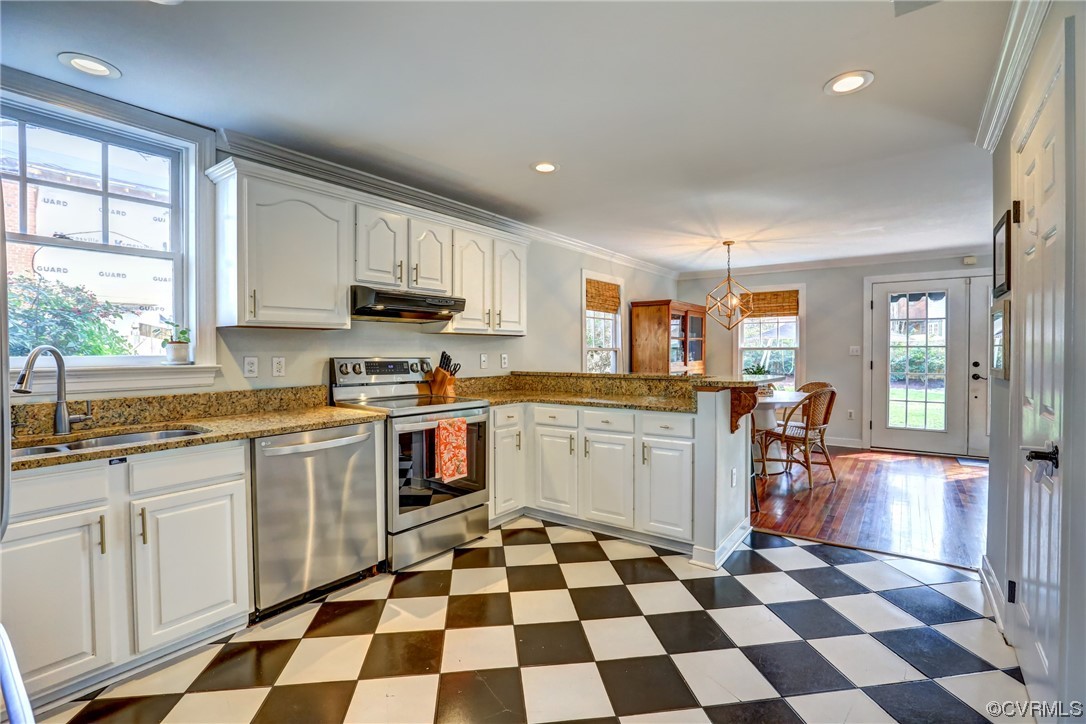 903 Baldwin Road Henrico, VA 23229 - Photo 17 of 46 a kitchen with granite countertop stainless steel appliances a sink a counter top space and a window
