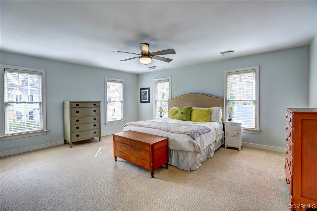 903 Baldwin Road Henrico, VA 23229 - Photo 32 of 46 a spacious bedroom with a bed a dresser and a window