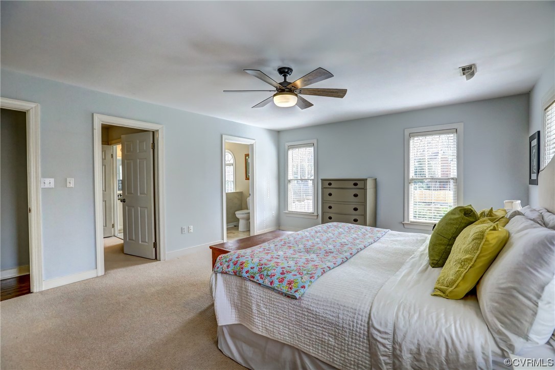 903 Baldwin Road Henrico, VA 23229 - Photo 33 of 46 a bedroom with a bed ceiling fan and a window