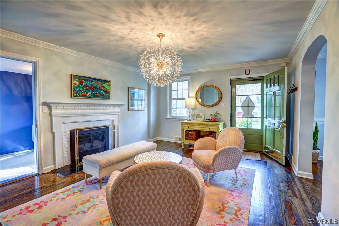 903 Baldwin Road Henrico, VA 23229 - Photo 9 of 46 a living room with furniture a fireplace and a chandelier