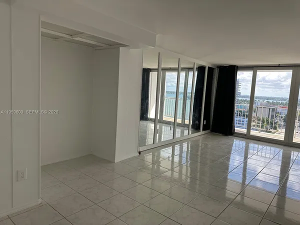 a kitchen with granite countertop a stove microwave and cabinets