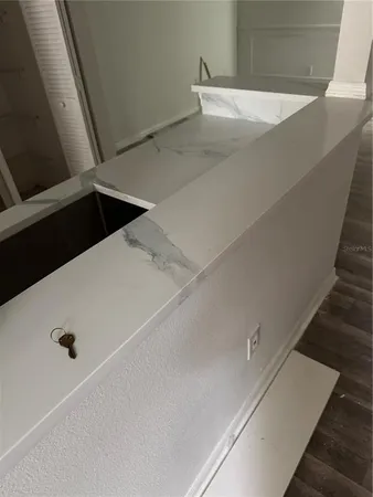 a kitchen with a sink a stove and a refrigerator