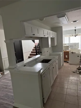 a view of a hallway and a livingroom