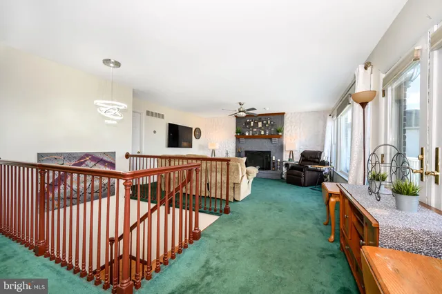 a view of a balcony with wooden floor and fence