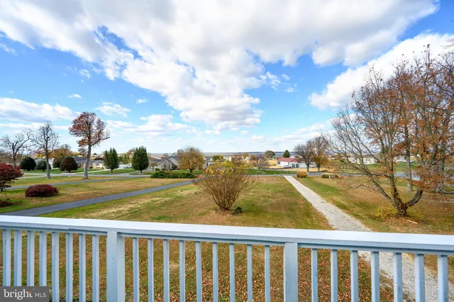 a bathroom with a tub sink and a mirror