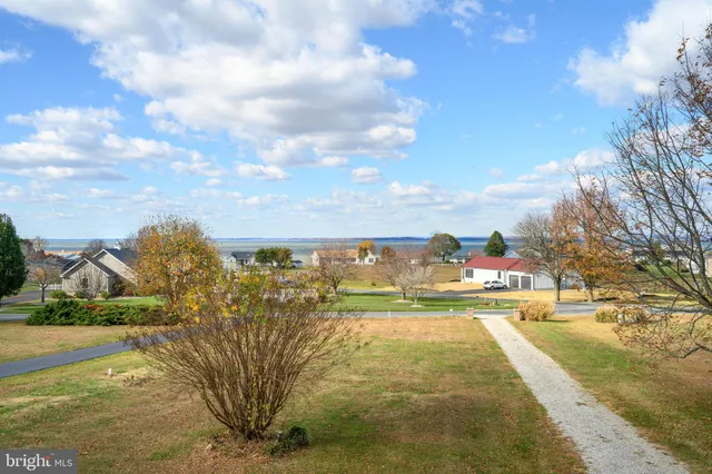a spacious bathroom with a sink mirror and vanity