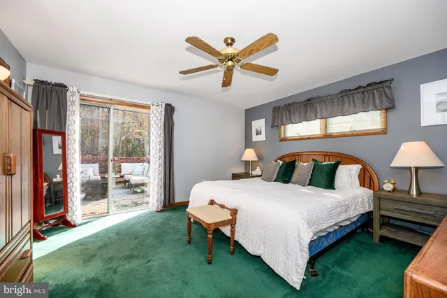 a bed room with a bed and a chair