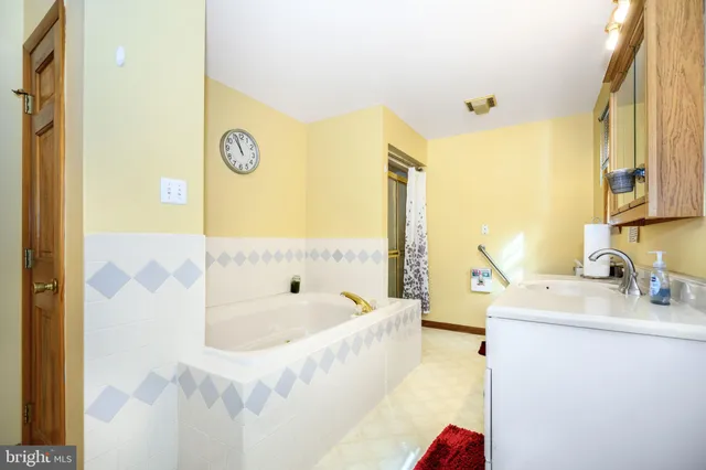 a utility room with cabinets dryer and washer