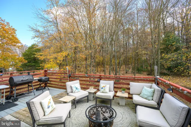 a wooden bench sitting in middle of a yard