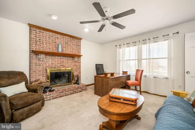 a view of a hallway with wooden floor and entryway