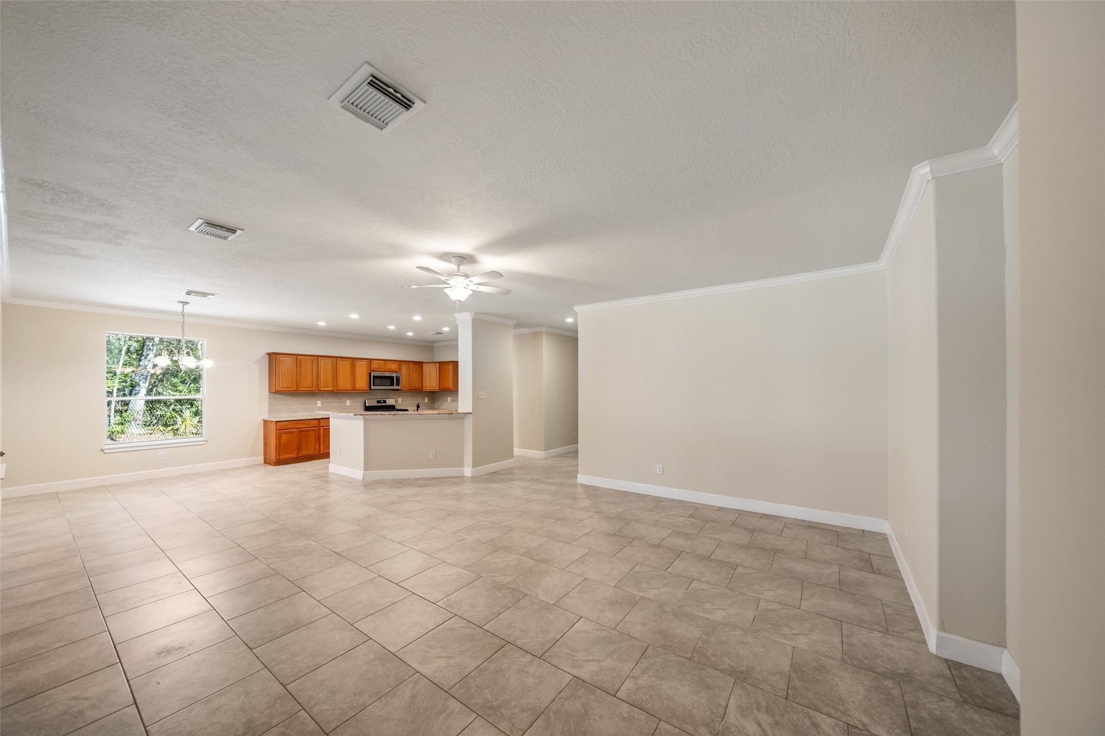 29627 Spring Forest Drive Spring, TX 77386 - Photo 13 of 29 View of living area from entry to primary bedroom.
