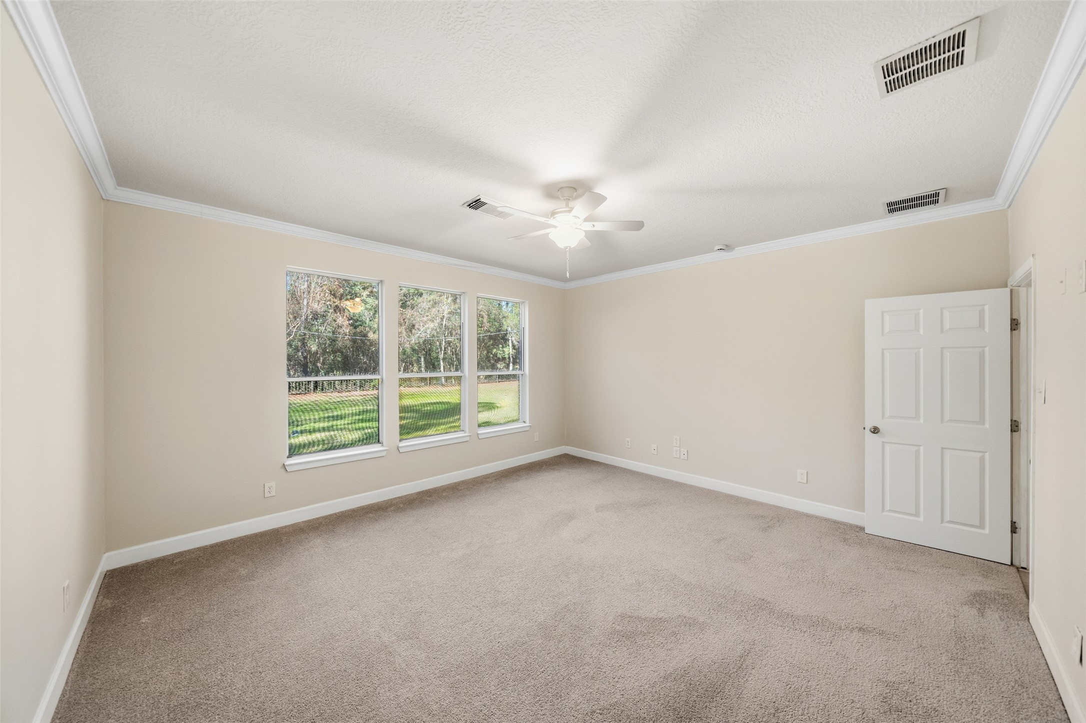 29627 Spring Forest Drive Spring, TX 77386 - Photo 15 of 29 Great views from the 3 large windows in the primary bedroom.