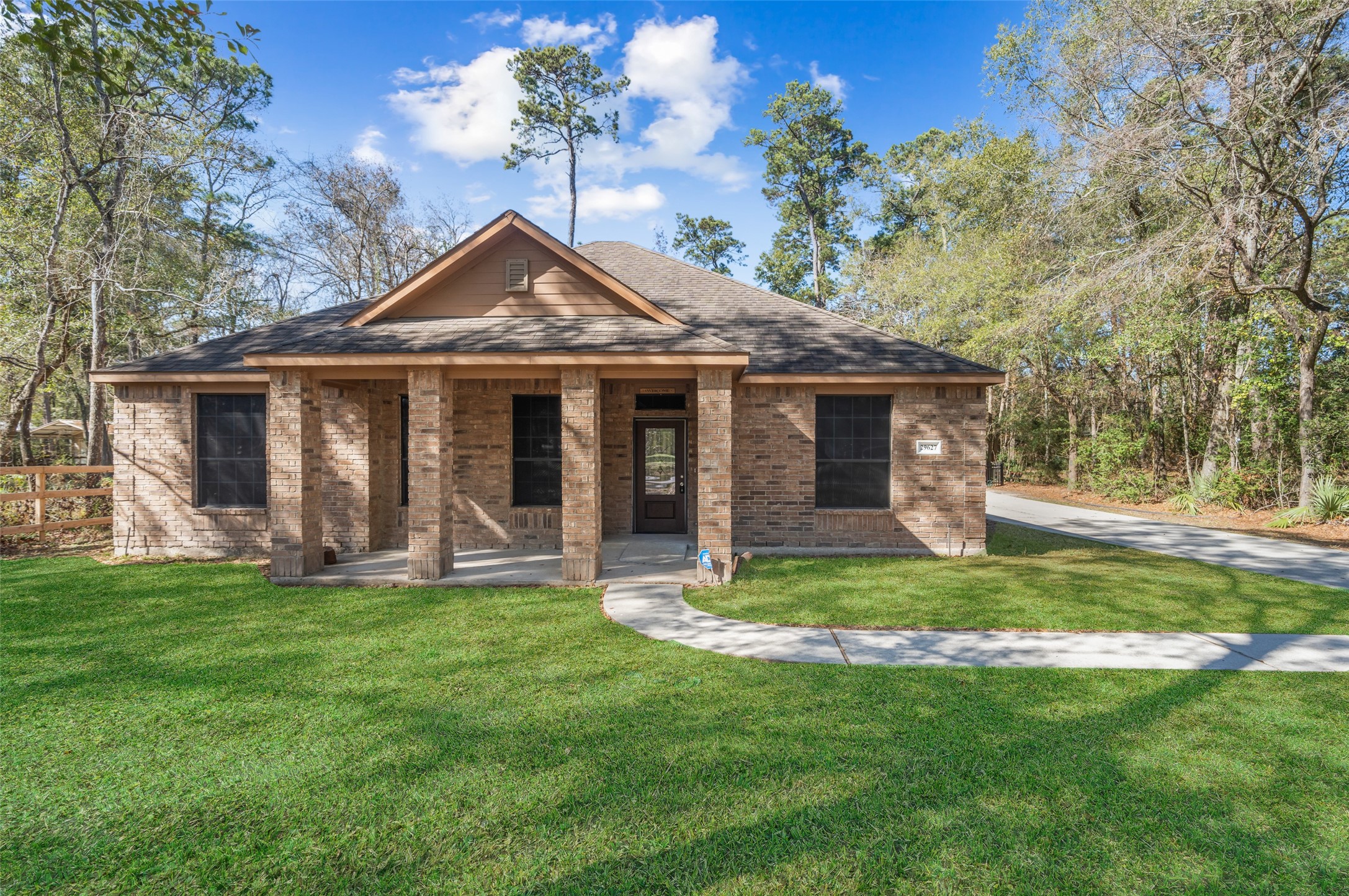 29627 Spring Forest Drive Spring, TX 77386 - Photo 2 of 29 Covered porch and cement ramp going at front entry