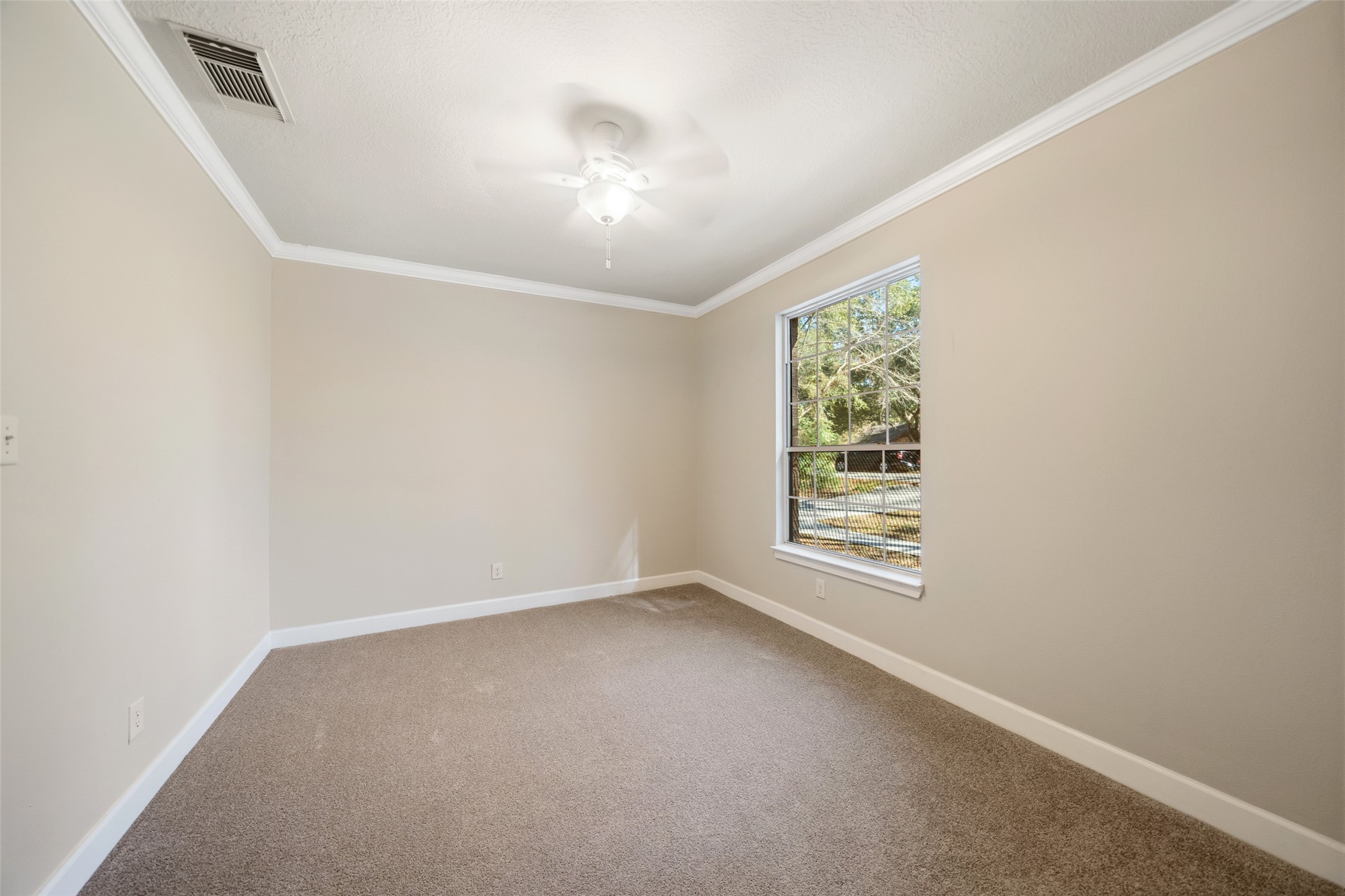 29627 Spring Forest Drive Spring, TX 77386 - Photo 23 of 35 an empty room with windows and fan